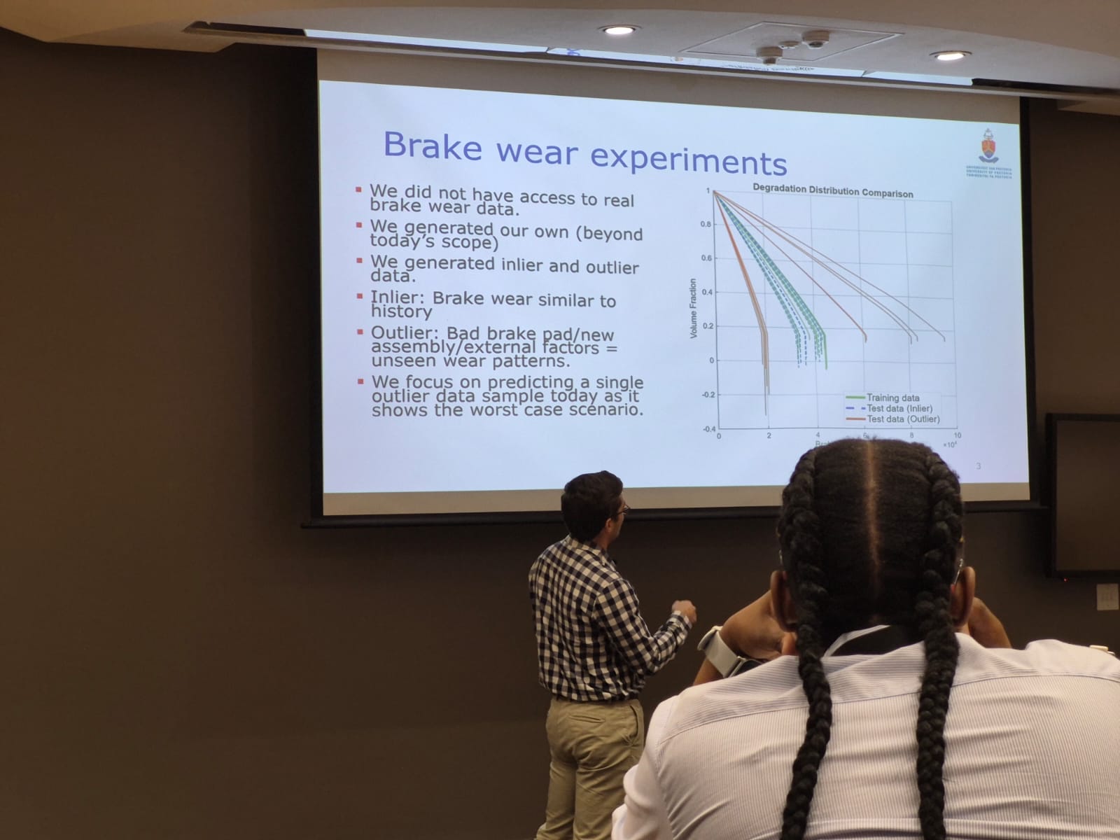 AFRICOMP 2026 slide describing brake-wear experiments in mechanised mining vehicles